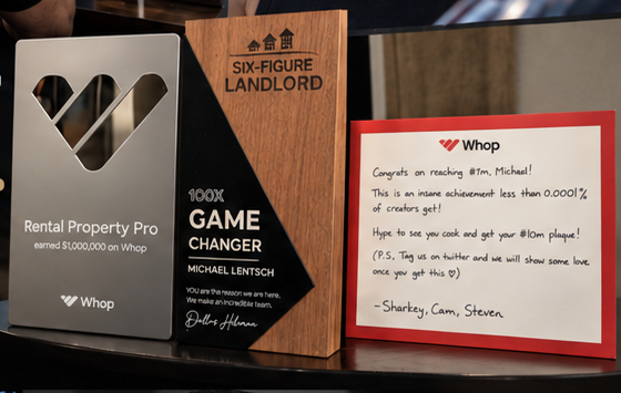 Michael Lentsch's award plaques and the note from the Whop team